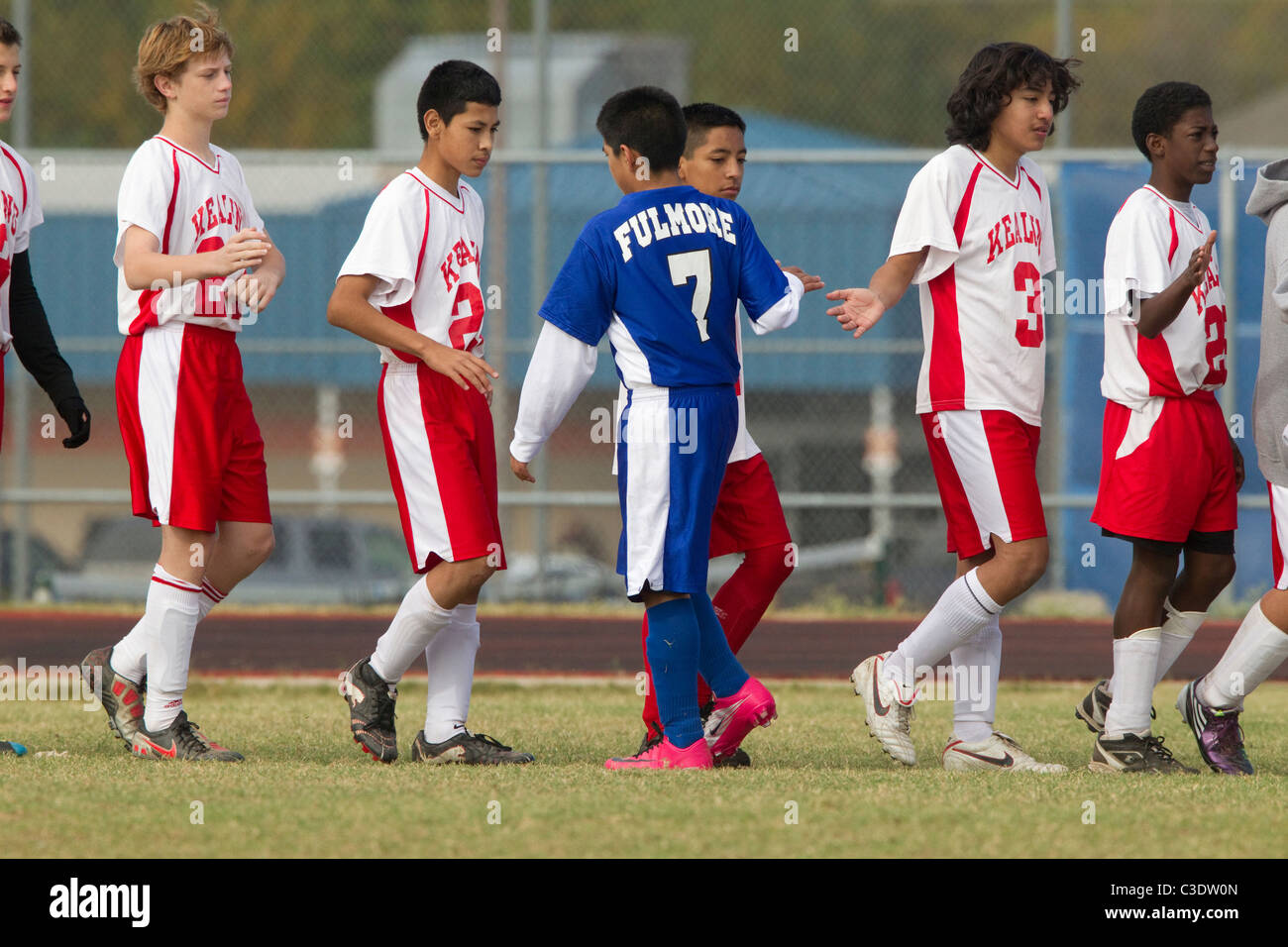 Anglo, Hispanic and AfricanAmerican players from opposing teams slap