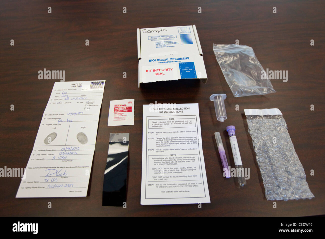 Evidence in a criminal case is displayed on a tabletop at the Texas Dept. of Public Safety Crime Lab in Austin Texas Stock Photo