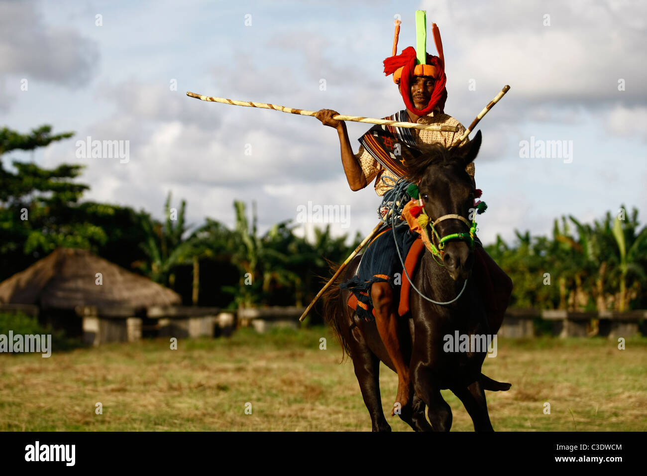 Sumba tribal warrior rides a horse ,Wainyapu Village, West Sumba, Indonesia. Stock Photo