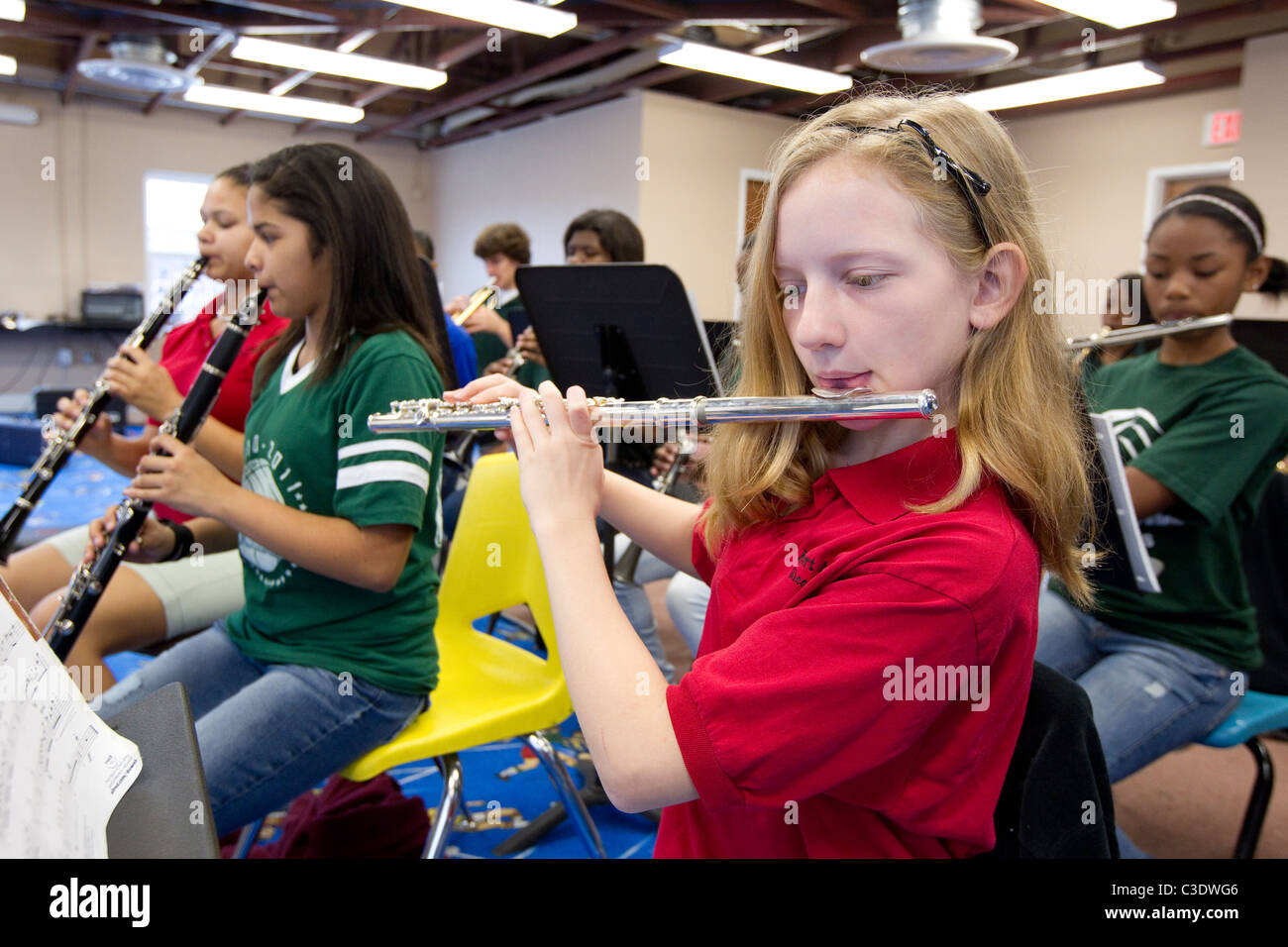 Female high school students play flutes and during band