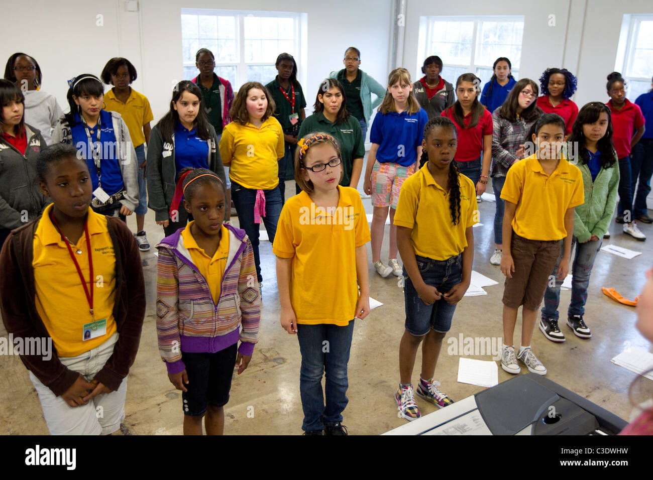 Middle school students warm up in choir practice at Rappaport Academy, a charter school in Waco, Texas Stock Photo