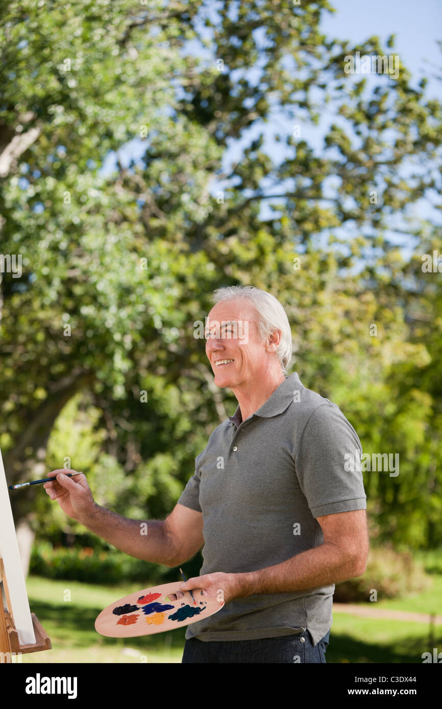 Man in garden painting hi-res stock photography and images - Alamy