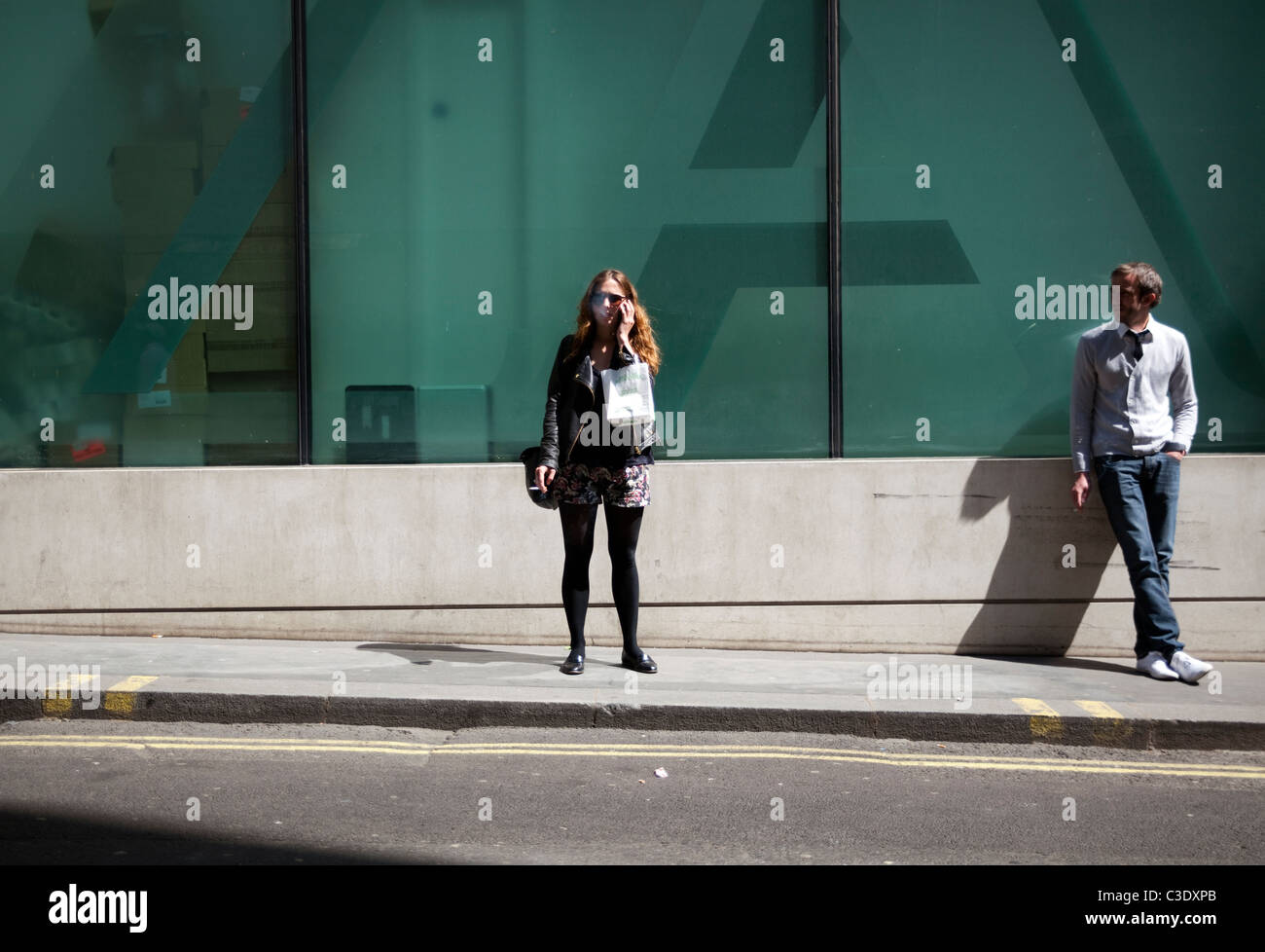 Oxford street in London with people on mobile phones Stock Photo Alamy