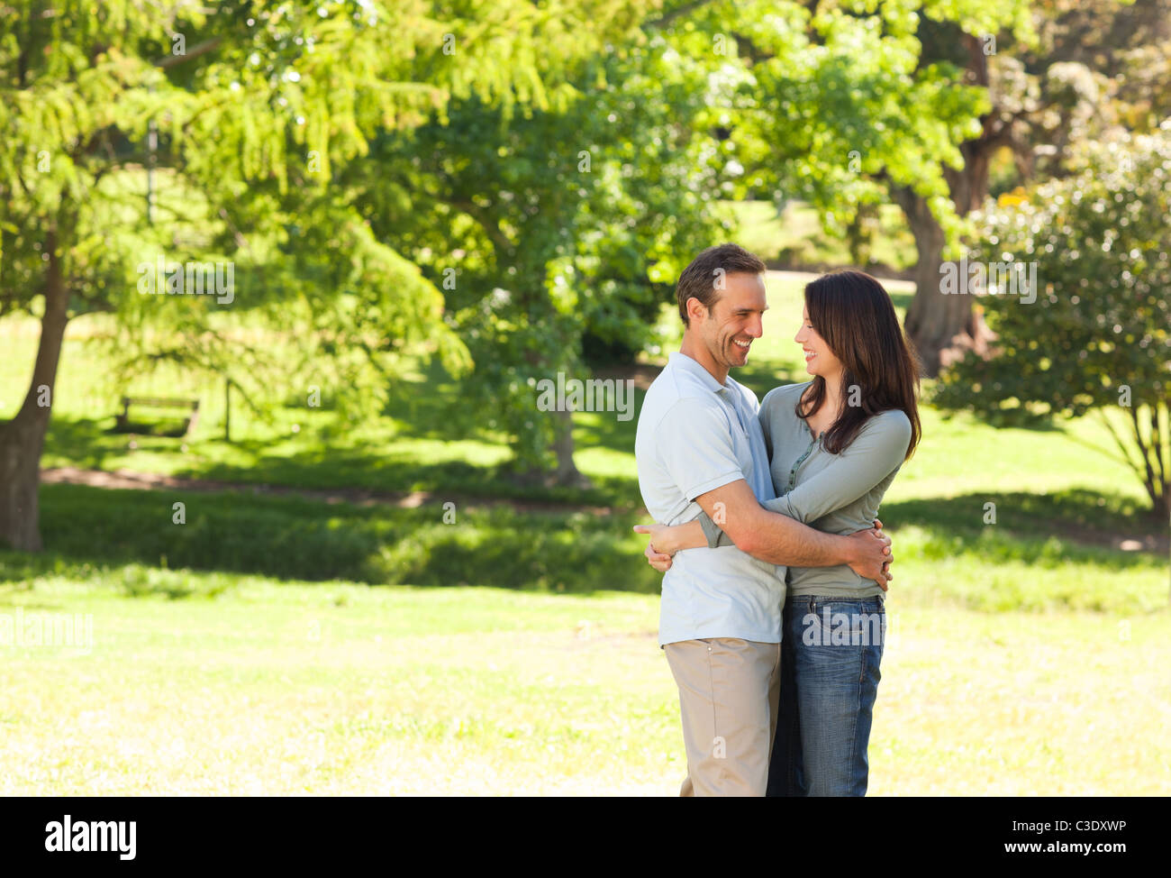 Pretty couple in the park Stock Photo - Alamy