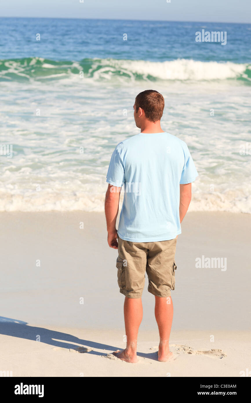 Handsome man looking at the sea Stock Photo - Alamy
