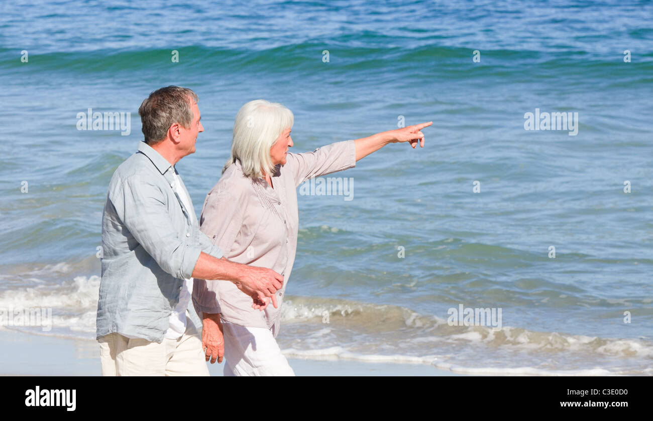 Elderly Couple Walking On The Beach Stock Photo - Alamy