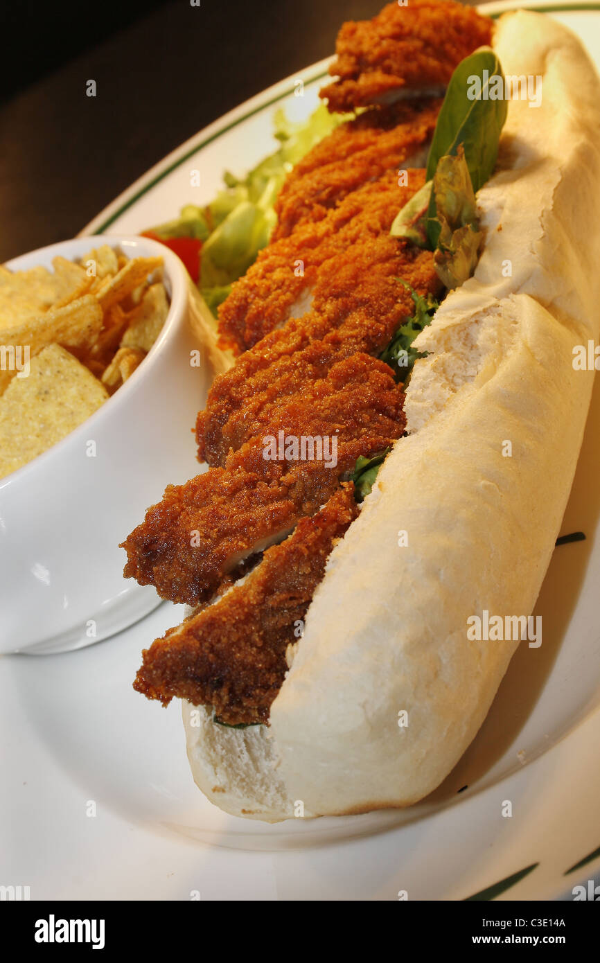 southern fried chicken baguette with tortilla chips Stock Photo Alamy