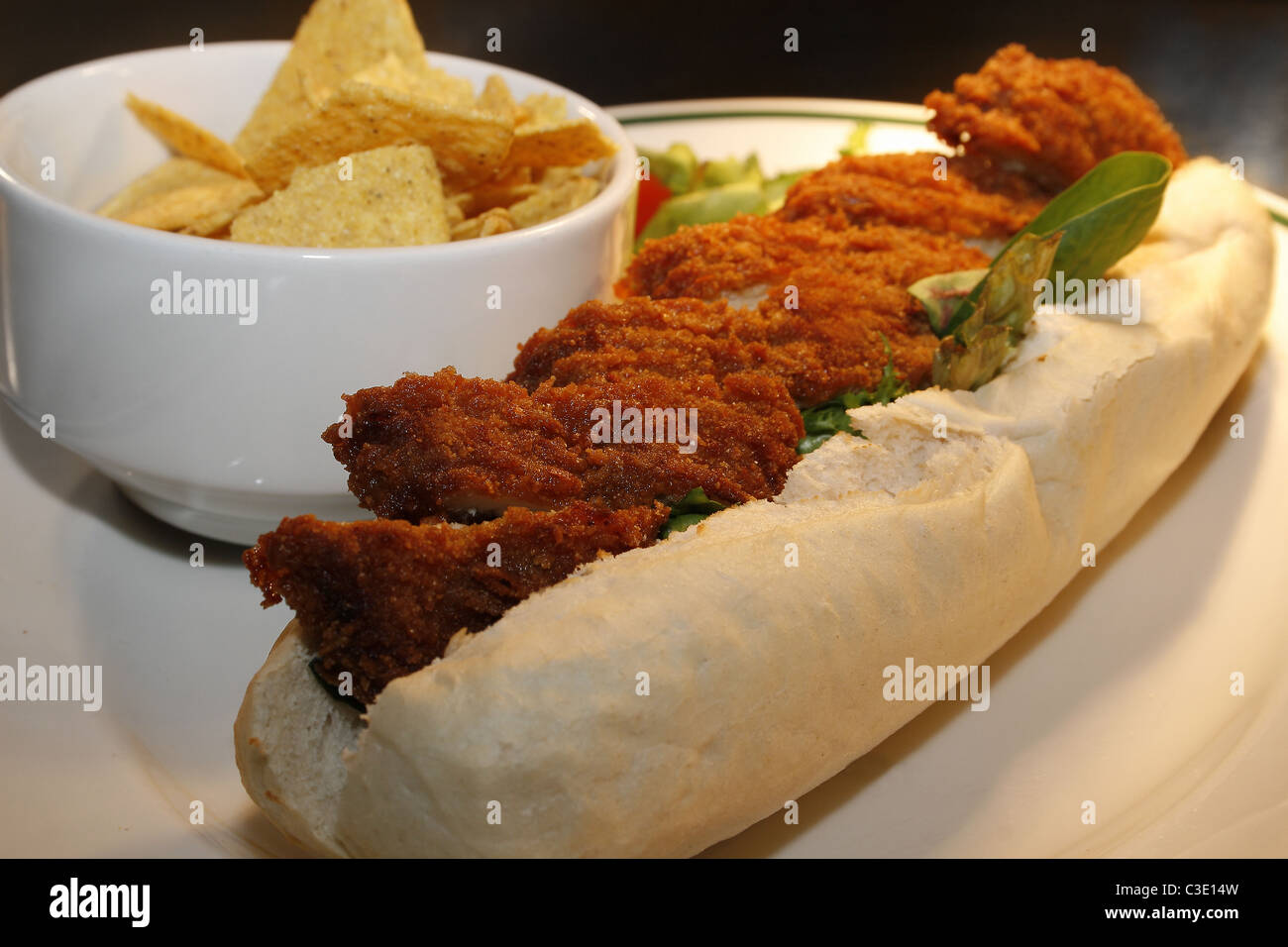 southern fried chicken baguette with tortilla chips Stock Photo