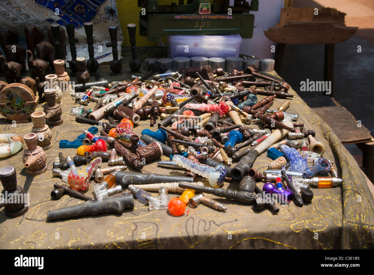 A quantity of pipe and hashish smoking paraphernalia on a market stall in Goa India. Stock Photo