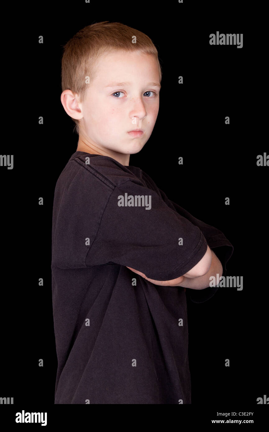 A photograph of a young boy with his arms crossed Stock Photo Alamy