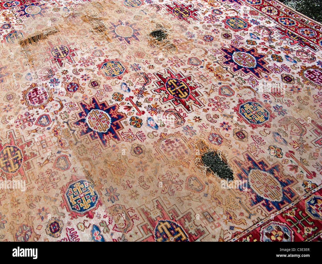 Well worn threadbare carpet Stock Photo Alamy