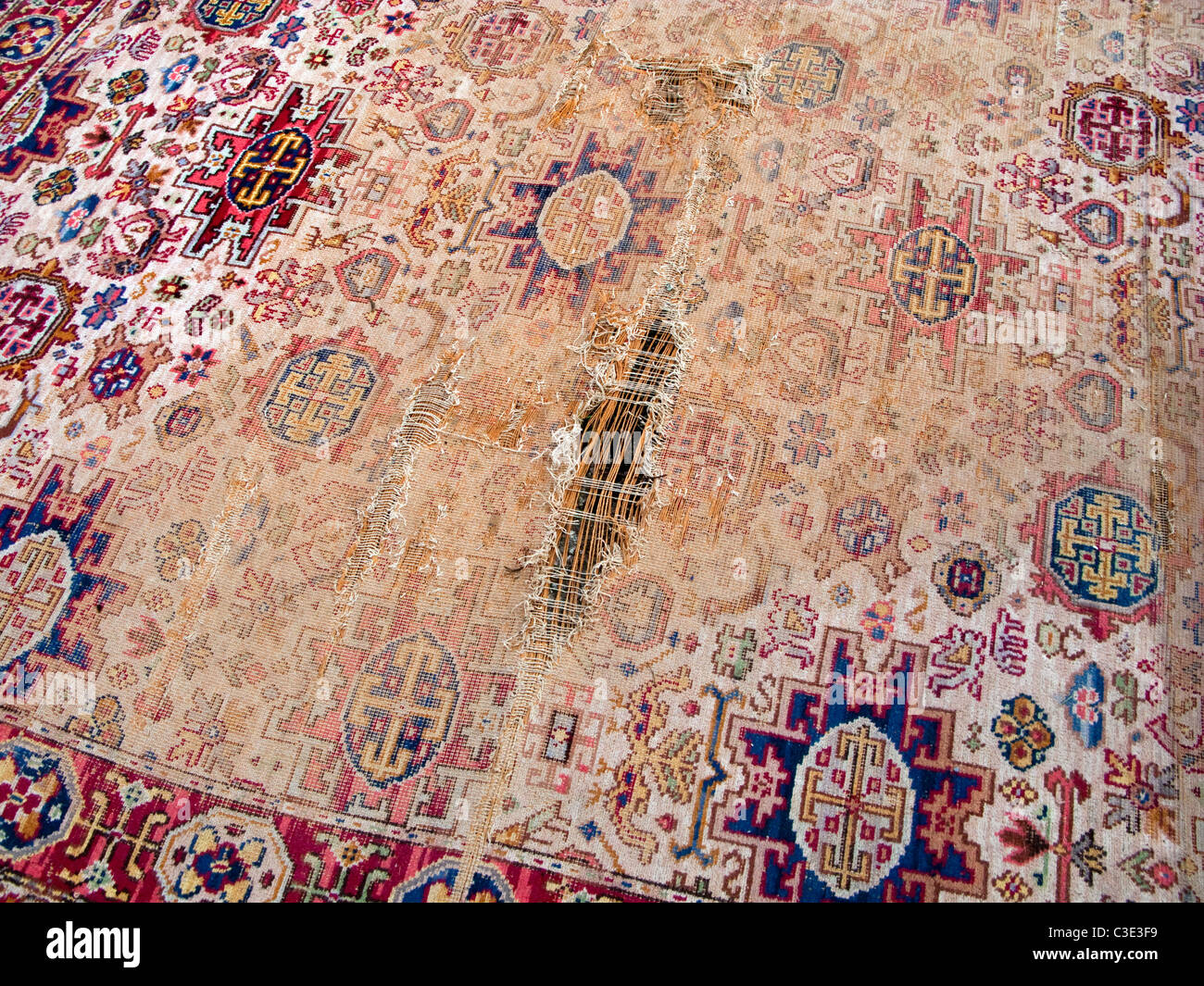 Well worn threadbare carpet Stock Photo Alamy