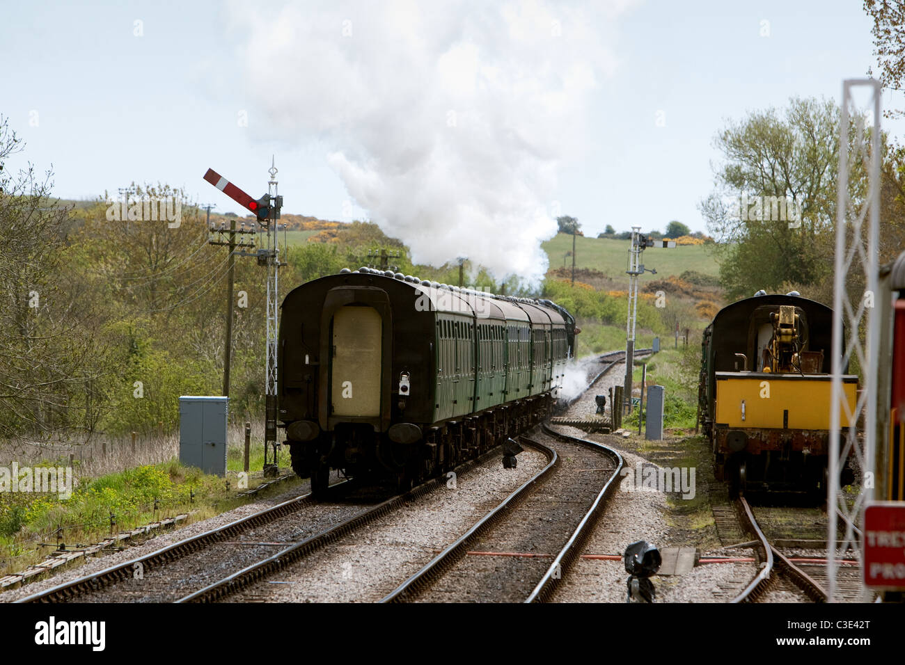 Steam train leaving Corfe Station rural railway station,   for Swanage England UK Stock Photo