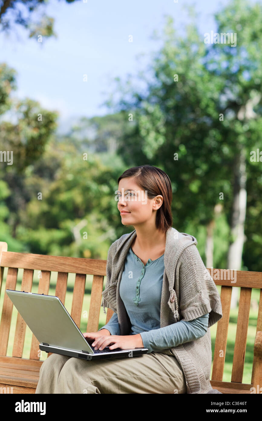 Young woman working on her laptop Stock Photo - Alamy