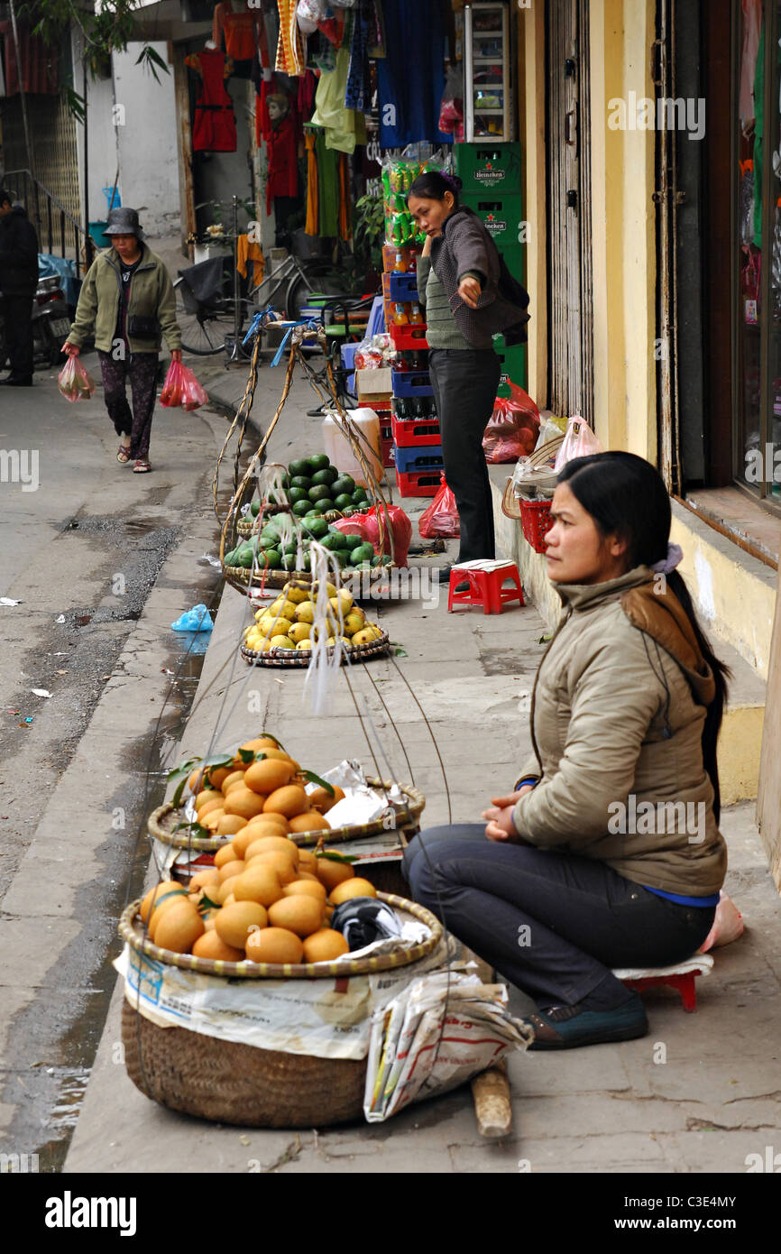 Lady selling food in street, Hanoi, Vietnam Stock Photo Alamy