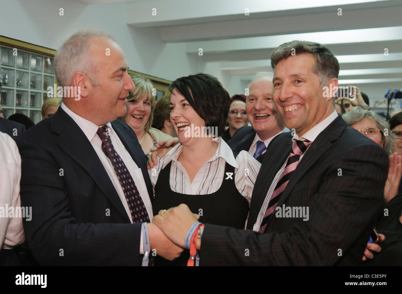 Trevor Clarke and Paul Girvan (DUP) congratulate each other as they are elected on 1st count for South Antrim Stock Photo