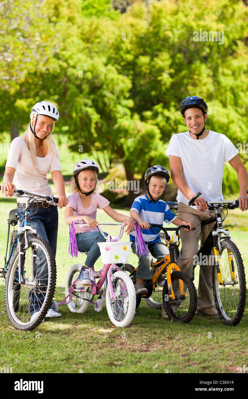 Family in the park with their bikes Stock Photo - Alamy