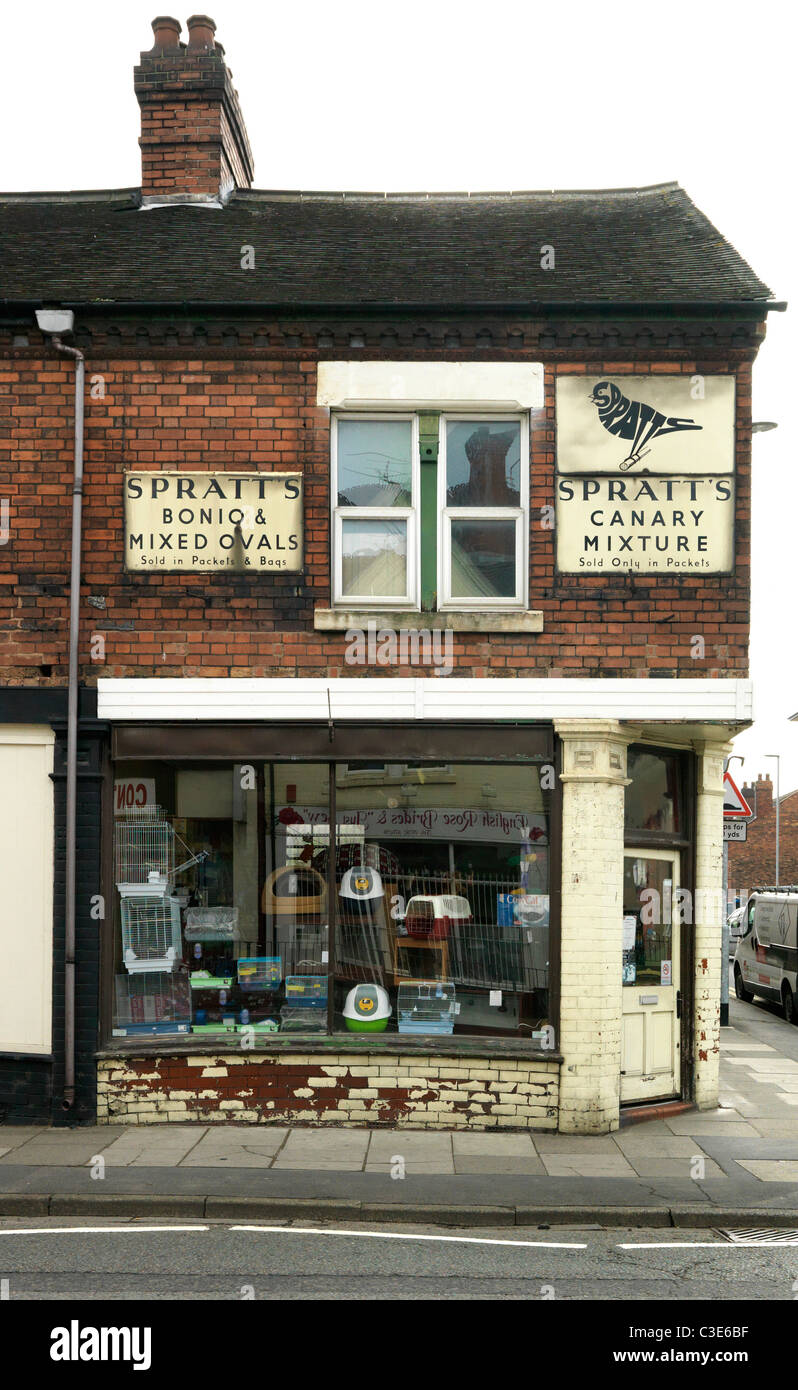 Old pet shop with signs on wall Stock Photo Alamy