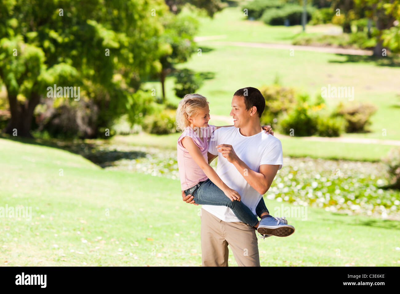 Father with her daughter in the park Stock Photo - Alamy