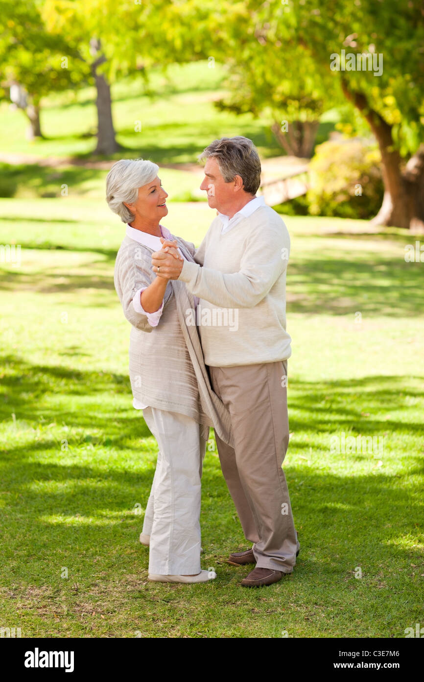 Senior couple dancing in the park Stock Photo - Alamy