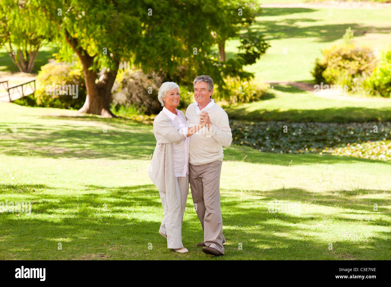Mature couple dancing in the park Stock Photo - Alamy