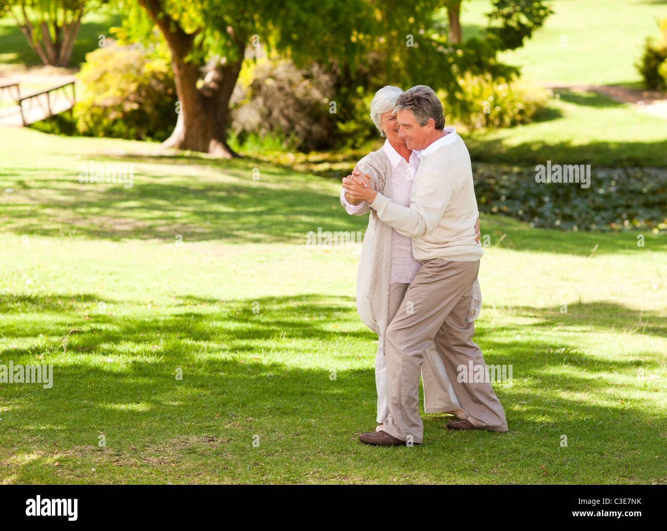 Mature couple dancing in the park Stock Photo - Alamy