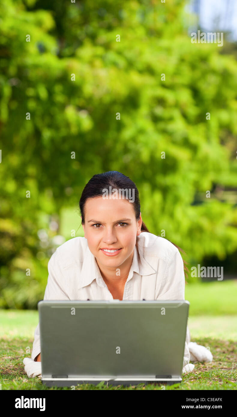 Young woman working on her laptop Stock Photo - Alamy