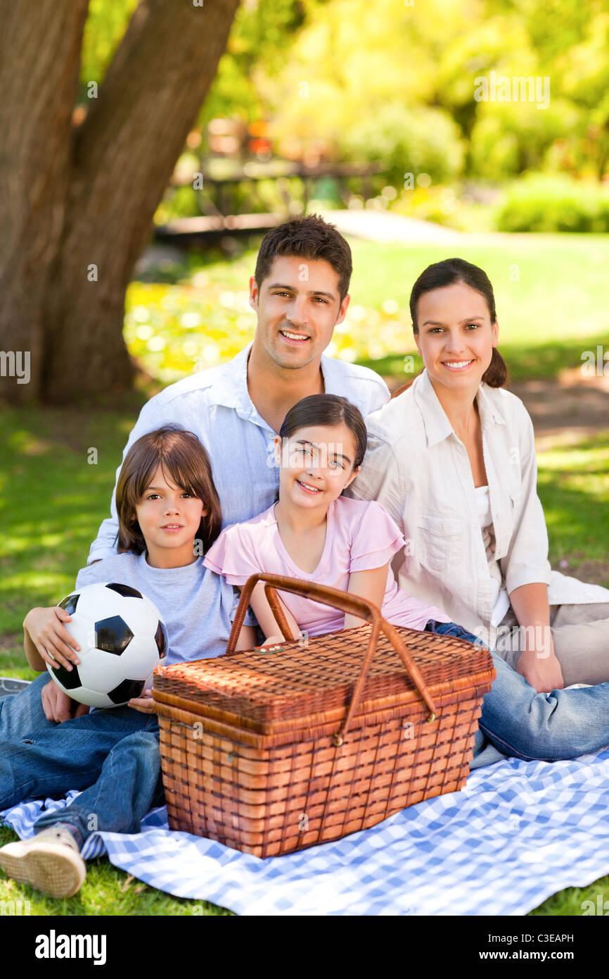 Happy family picnicking in the park Stock Photo - Alamy