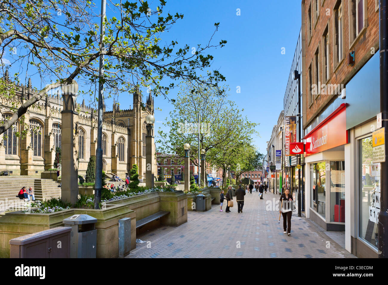 Shops along Kirkgate/Westgate near the Cathedral in the city centre, Wakefield, West Yorkshire, UK Stock Photo