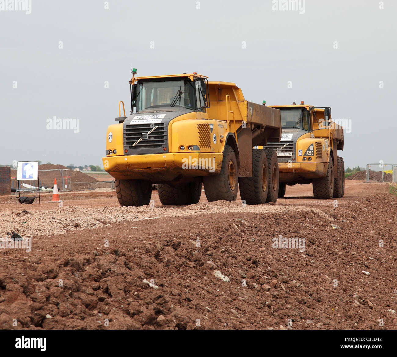 Volvo tipper trucks on the site of the A46 road widening scheme in Nottinghamshire, England, U.K. Stock Photo