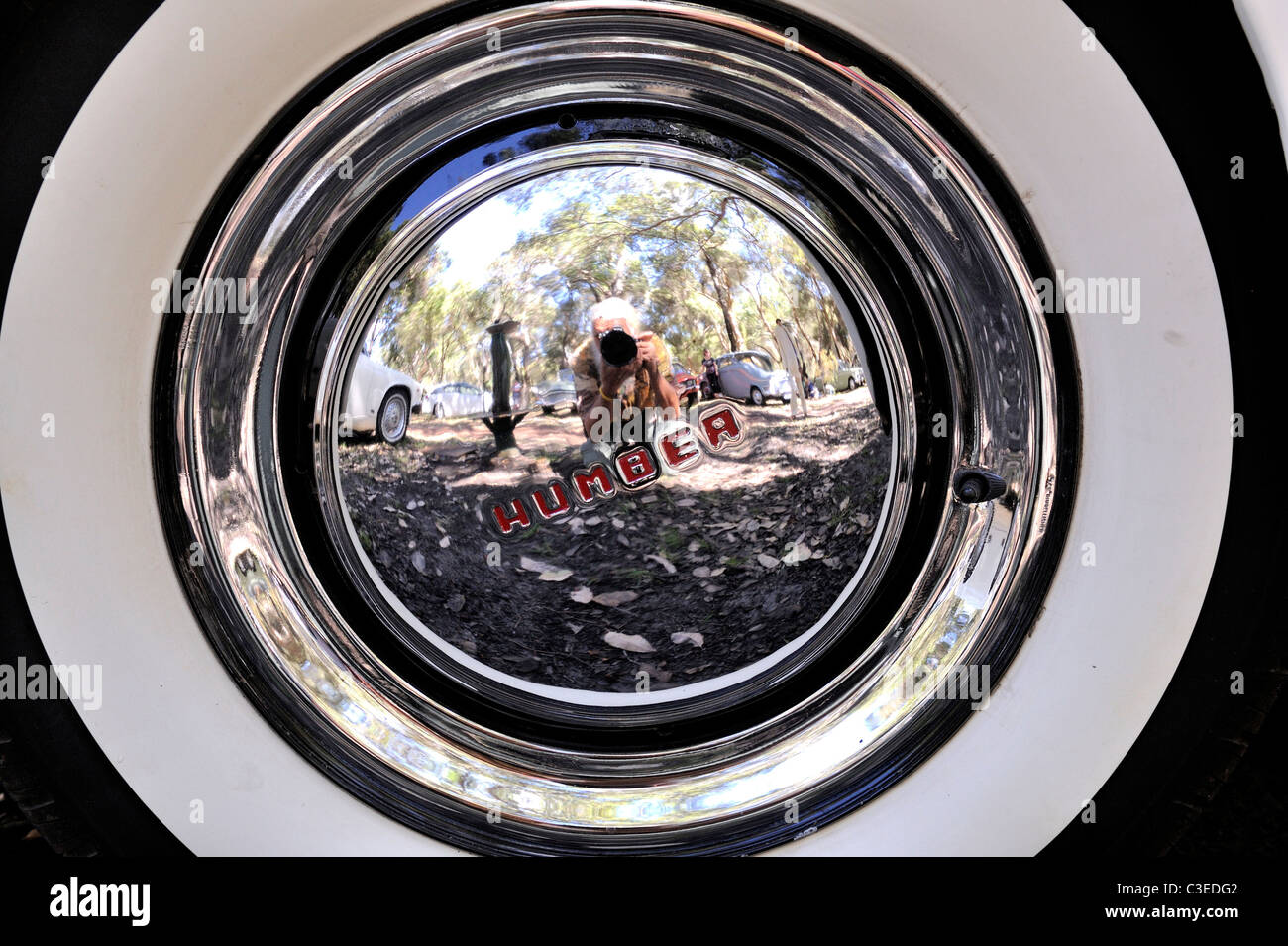 Photographer's reflection in vintage Humber automobile hubcap Stock Photo
