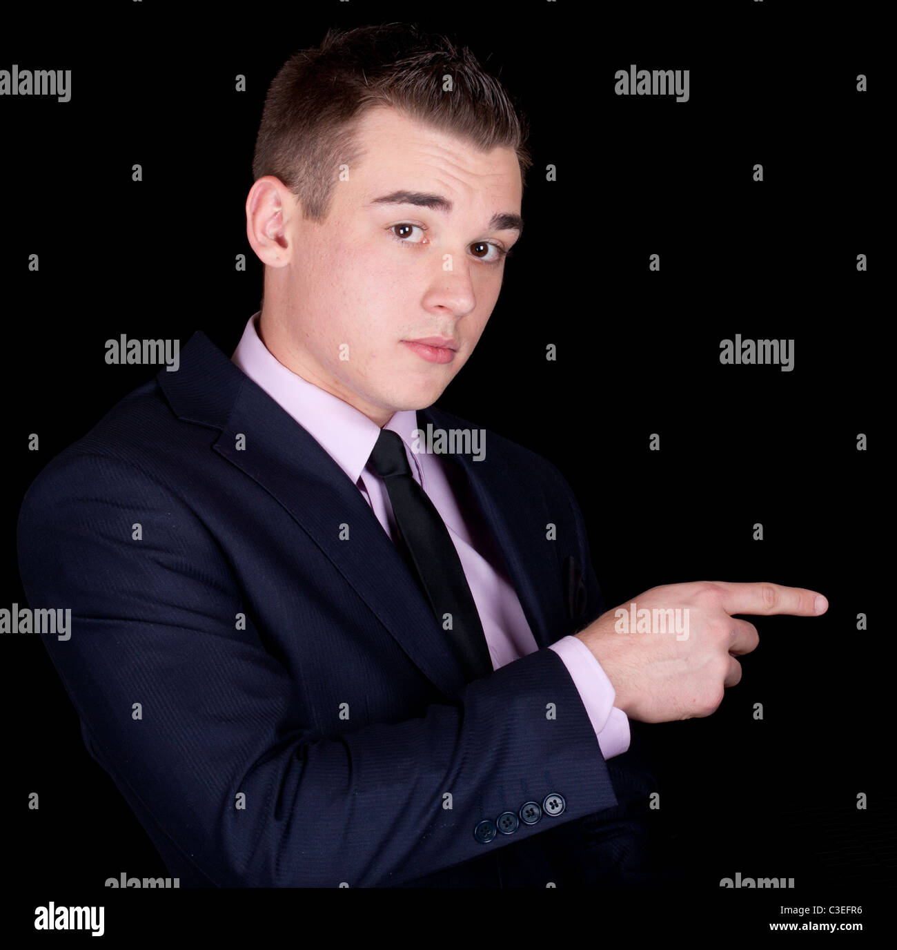 A photograph of a young executive pointing Stock Photo - Alamy