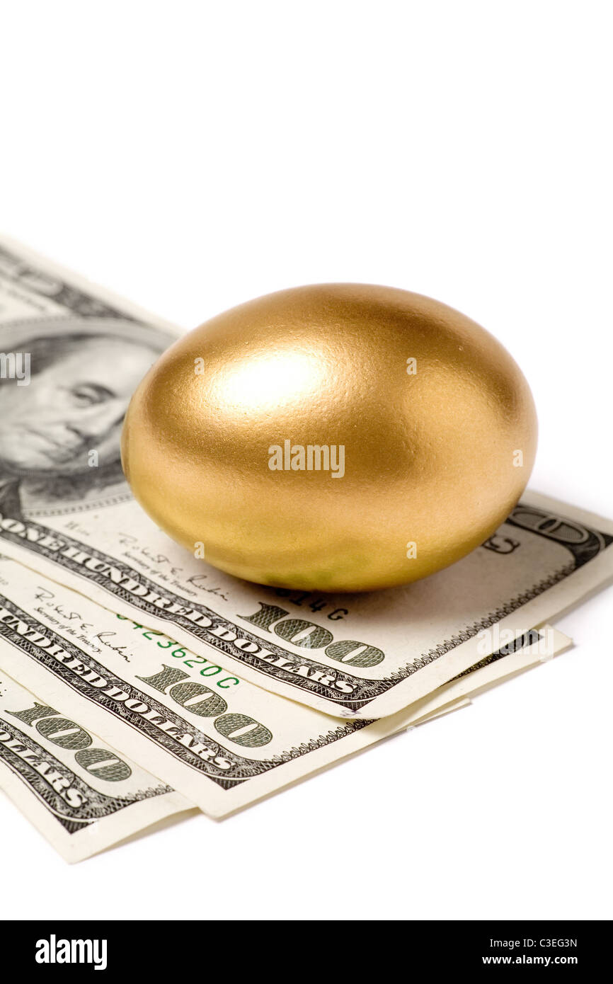 Golden eggs. A symbol of making money and successful investment on green  background Stock Photo - Alamy