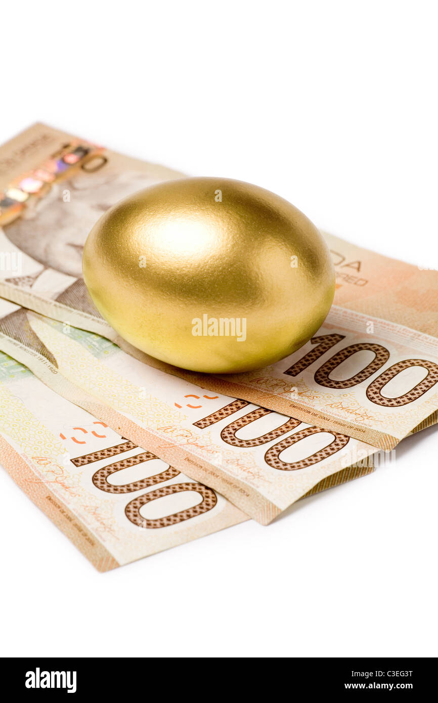 Golden eggs. A symbol of making money and successful investment on green  background Stock Photo - Alamy