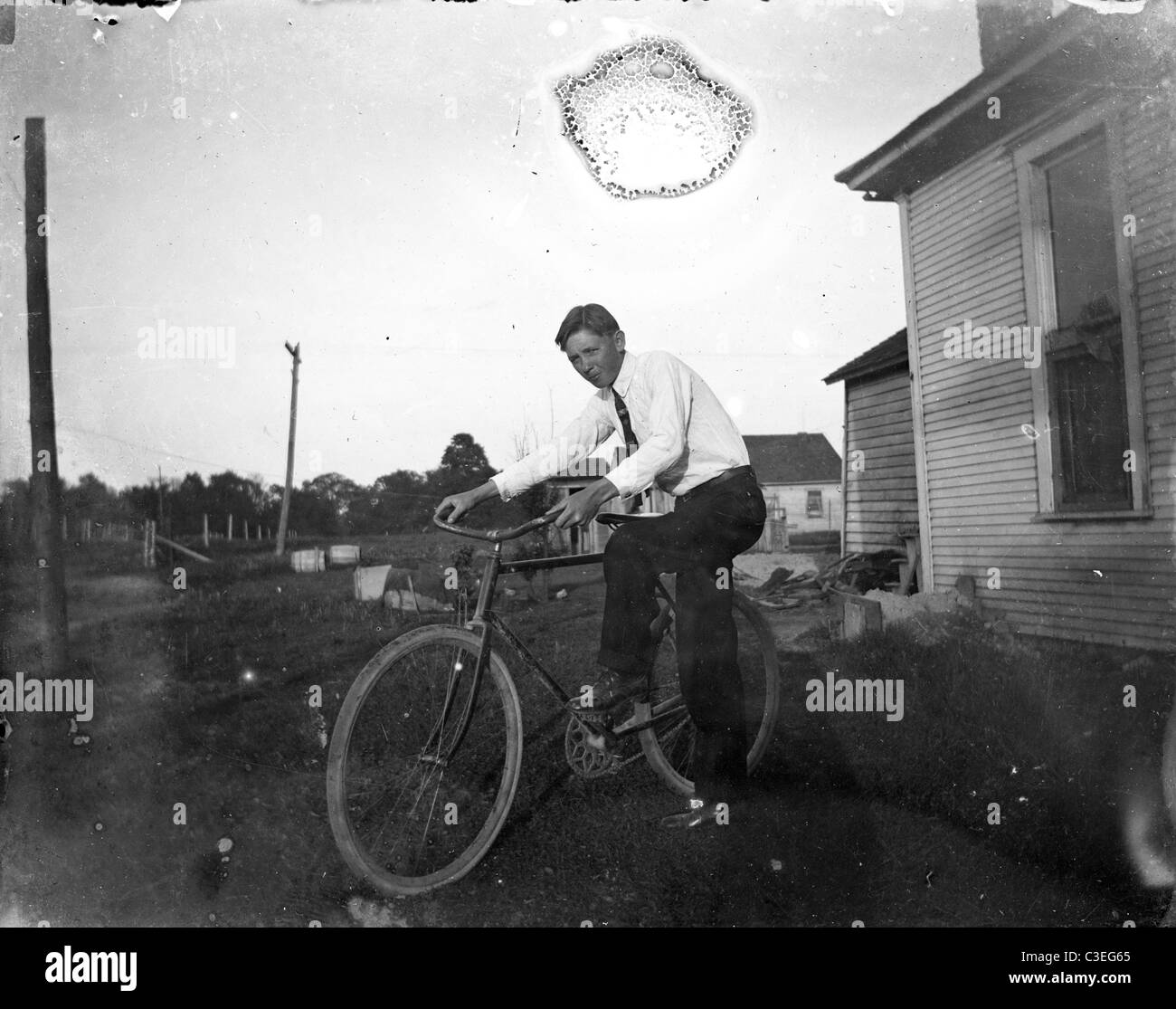 man on vintage bicycle outdoors 1890s Stock Photo