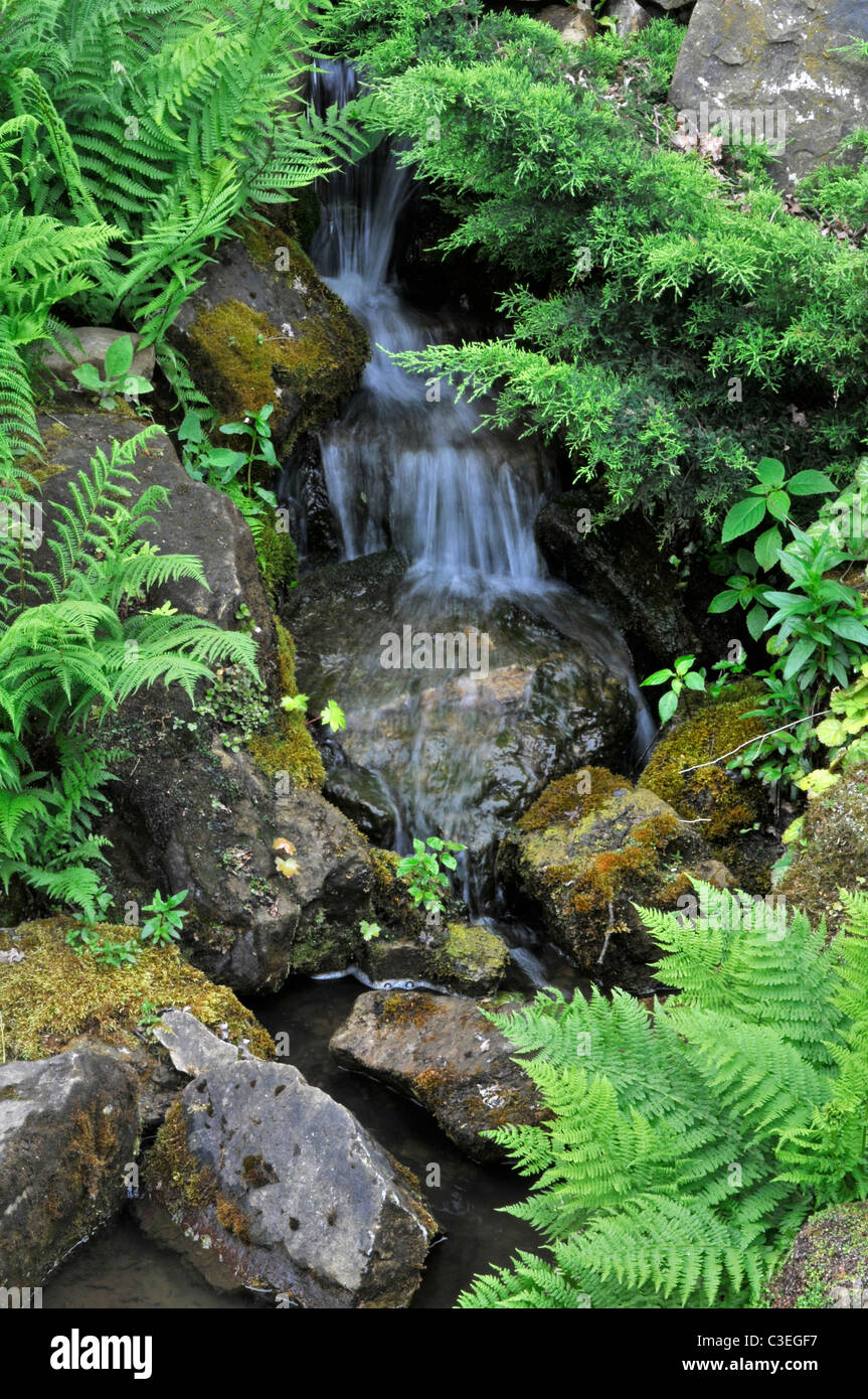 Waterfall in Rock garden. RHS Wisley, Surrey, England Stock Photo