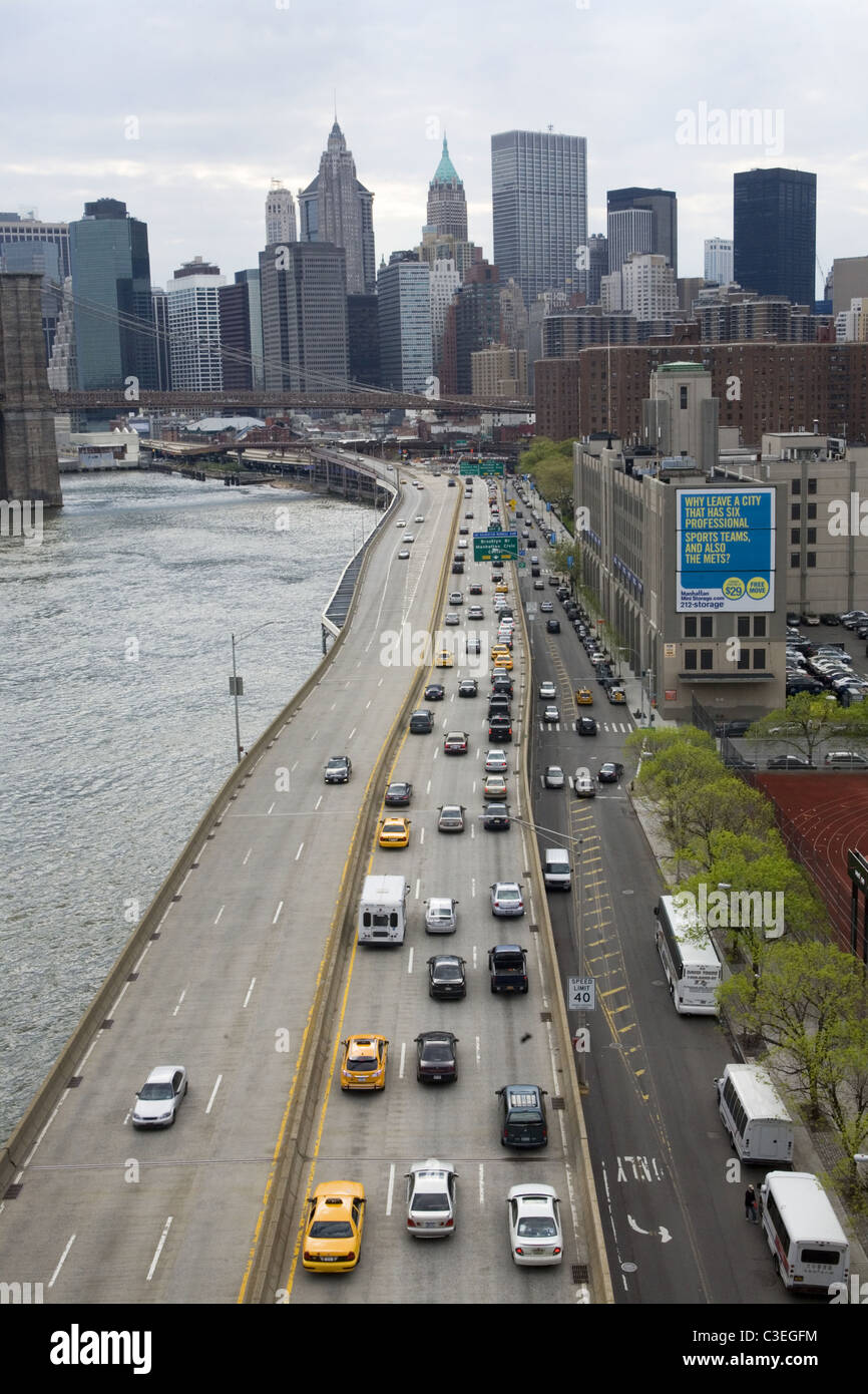 Looking south down the FDR Drive toward lower Manhattan along the East River from the Manhattan Bridge, New York City. Stock Photo