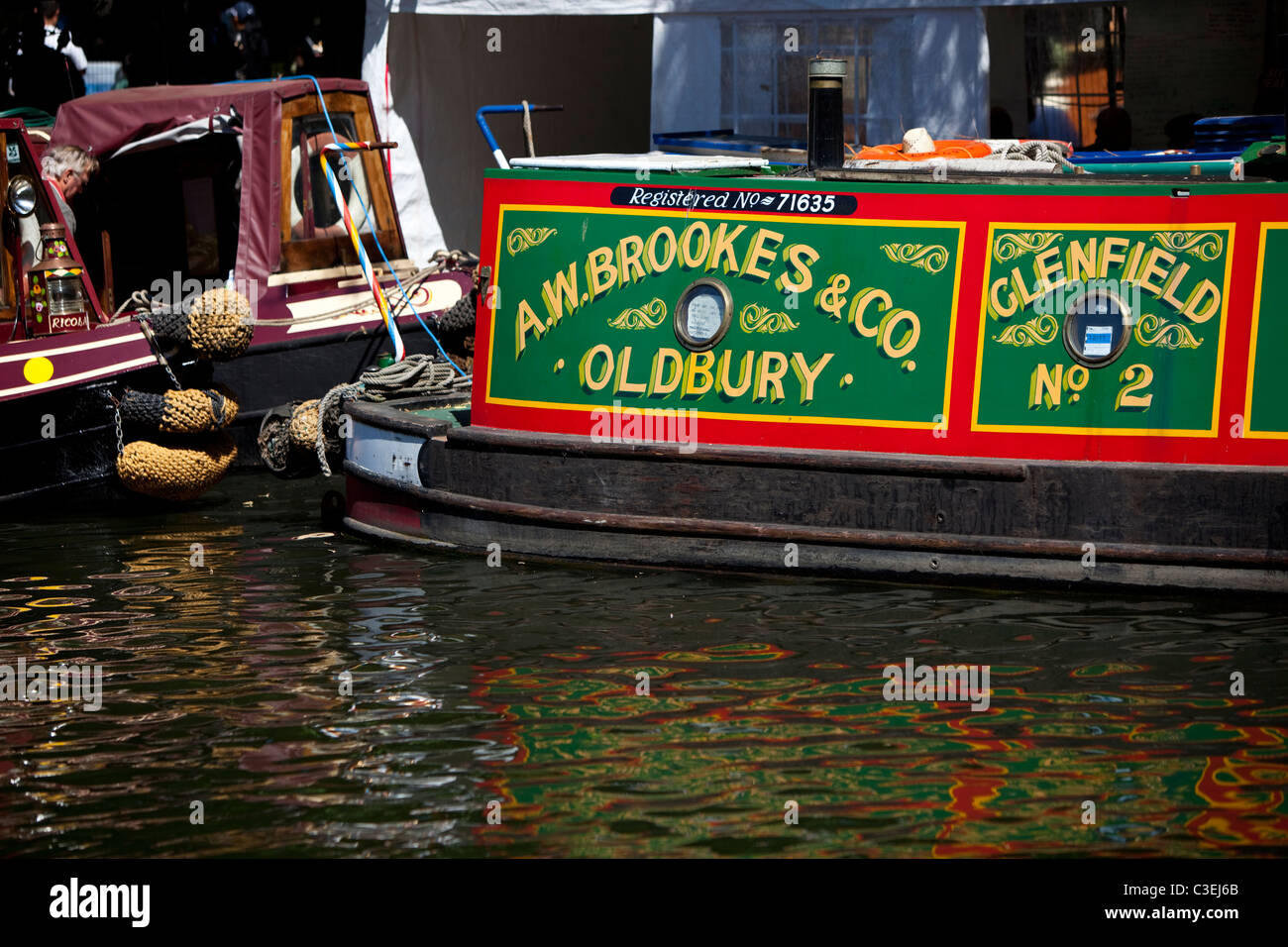 Narrowboat, with a painted sign on it, docked in Regent's Canal at Little Venice, London, England, UK Stock Photo