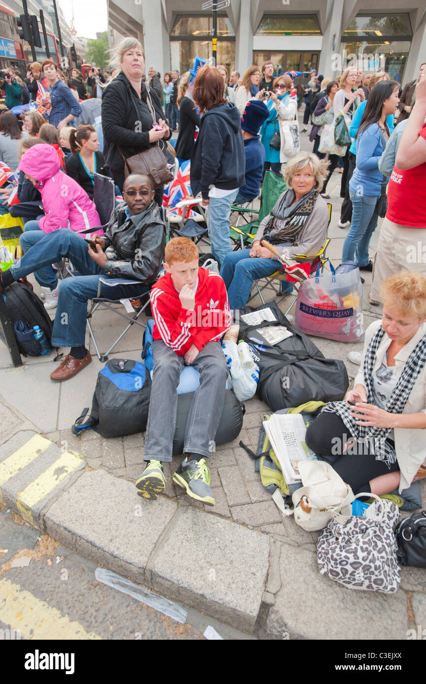 People camping out along the route of the Royal Wedding procession of Prince William and Kate Middleton, London 2011. Stock Photo