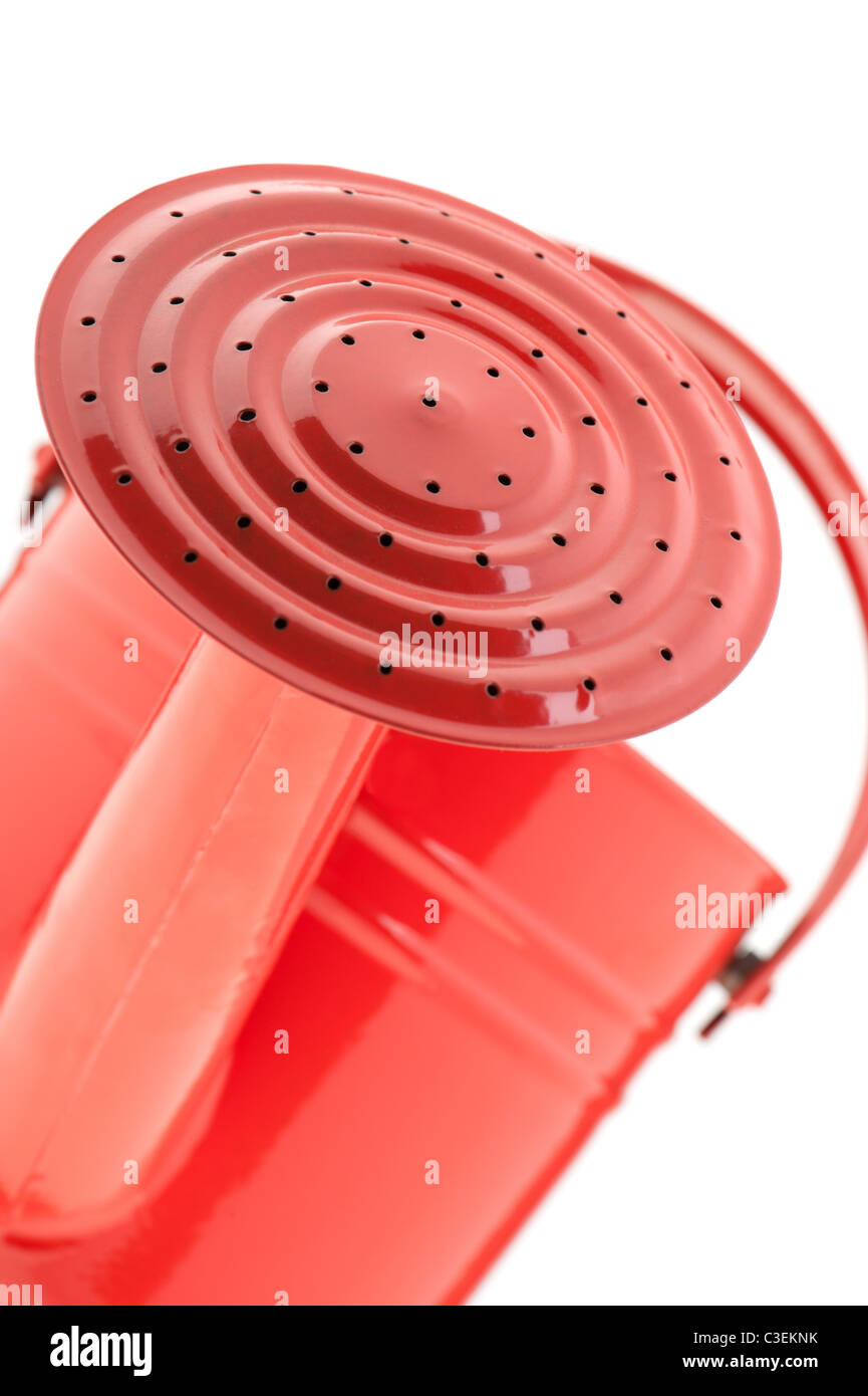 Red watering can. It is isolated on a white background Stock Photo - Alamy