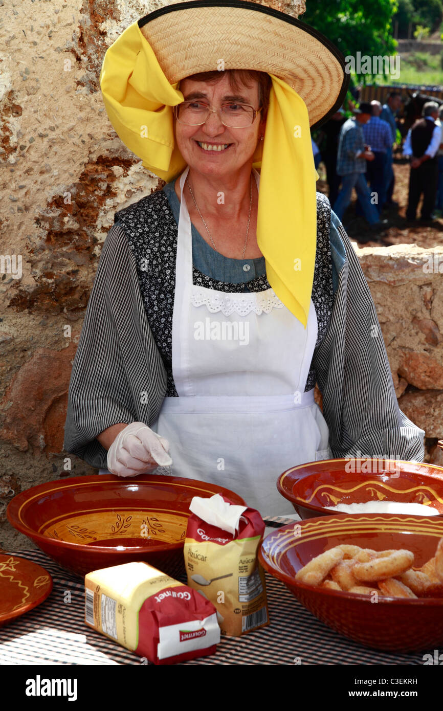 Ladies in traditional costume baking at a Handicraft Fair, Ibiza, Spain Stock Photo
