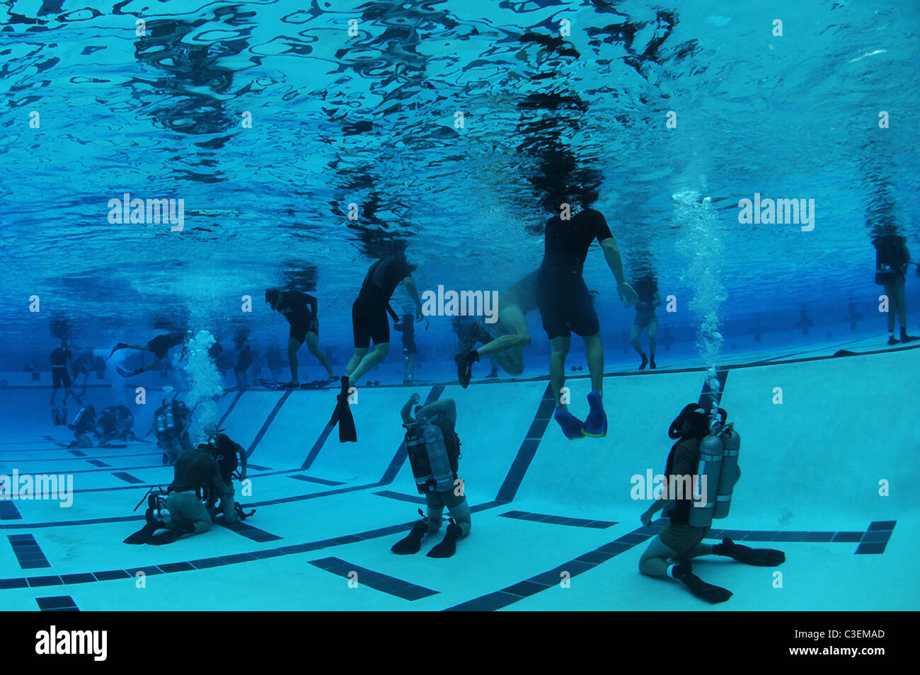 US Navy SEAL team candidates participate in night gear exchange during