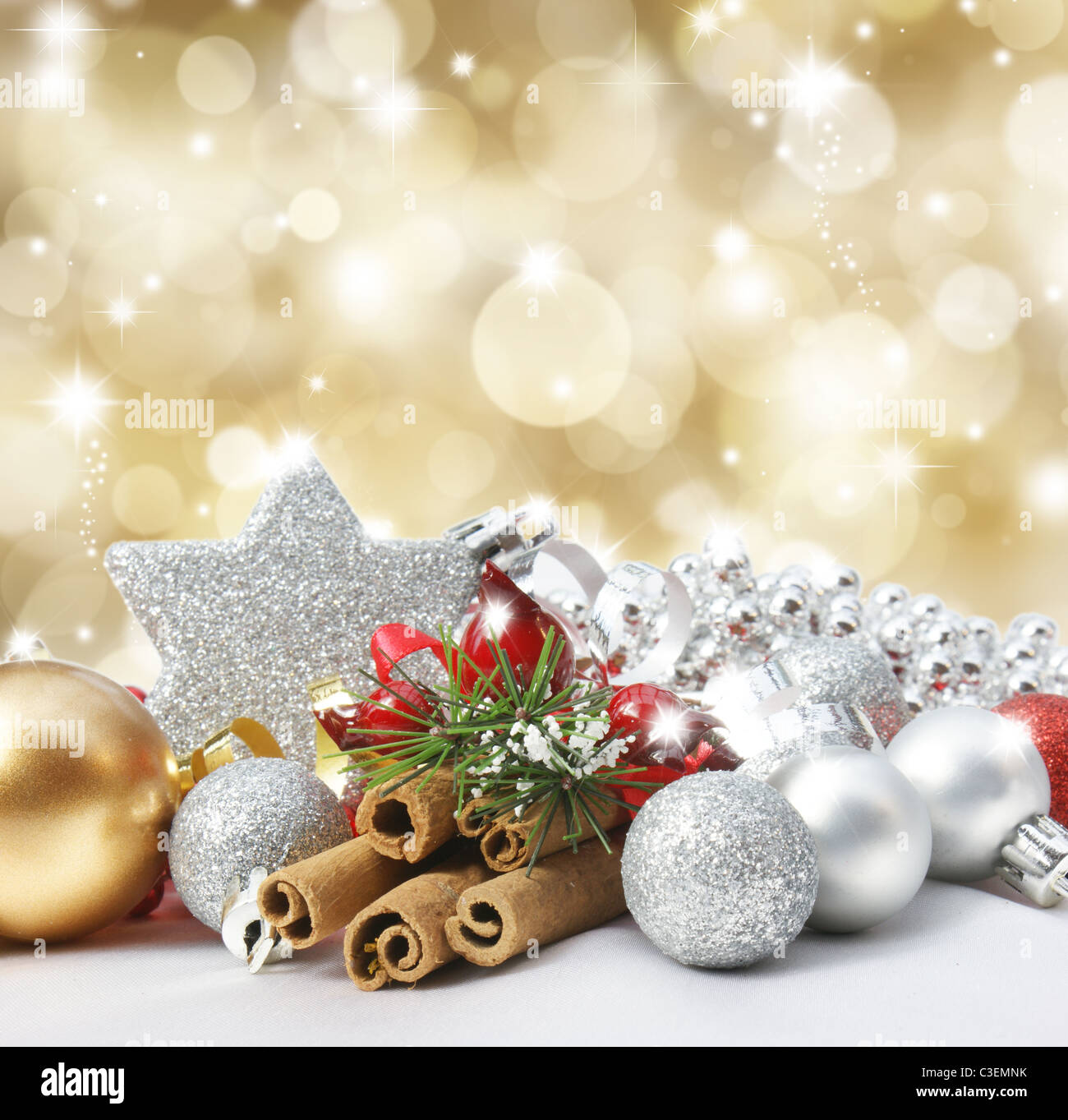 Christmas decorations on a glittery gold background Stock Photo - Alamy