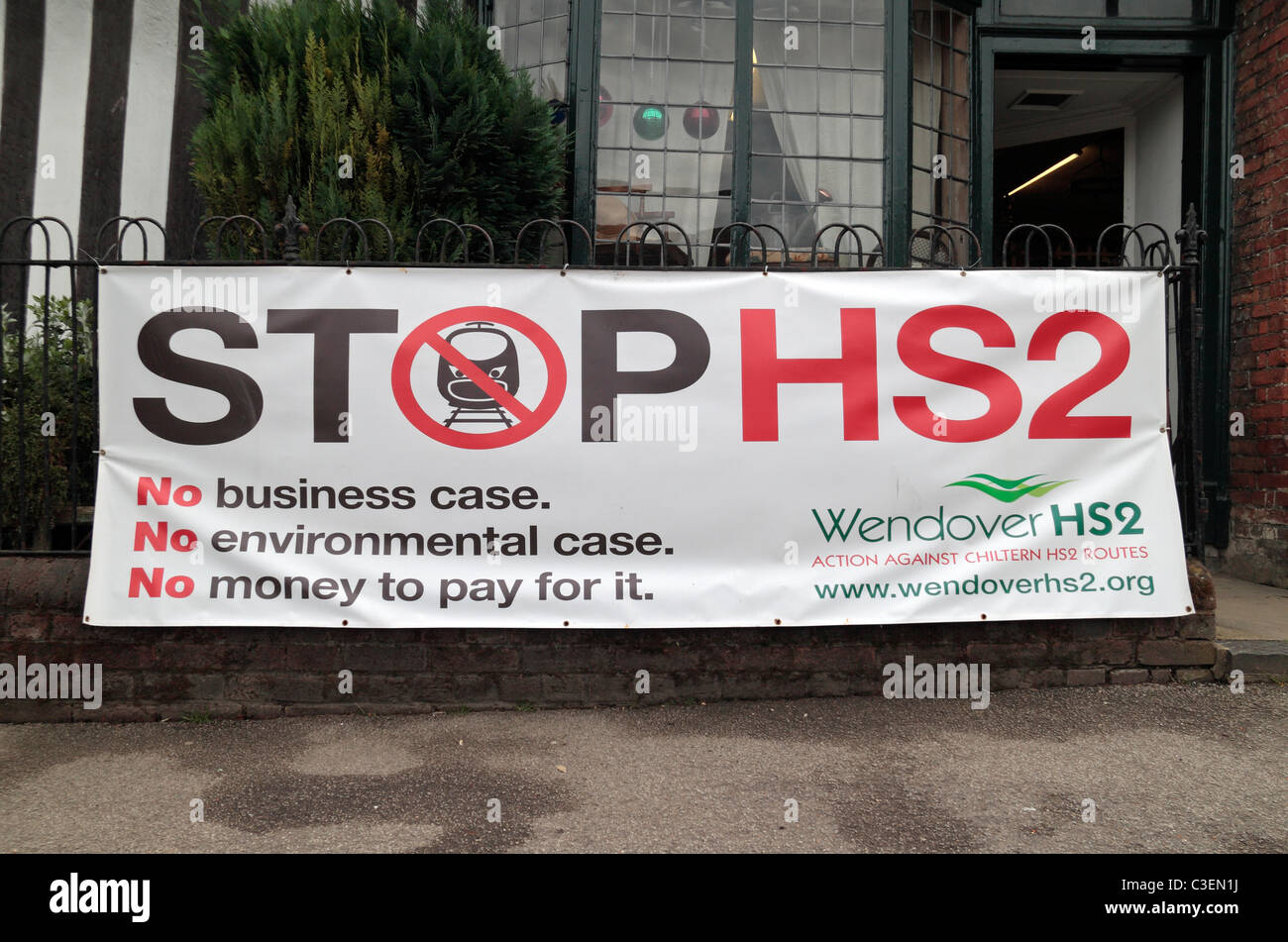 Anti High Speed 2 (HS2-proposed railway) poster on a railing (in May 2011) in the centre of Wendover, Buckinghamshire, UK. Stock Photo
