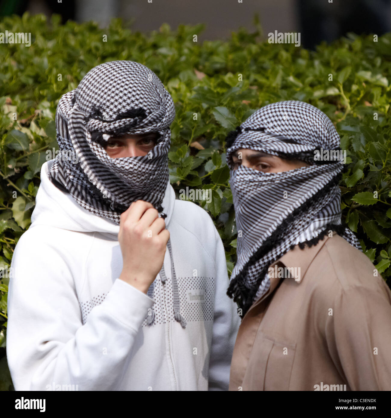 Muslim men with head scarves covering their faces during a vigil for Osama  Bin Laden outside the US Embassy Stock Photo - Alamy