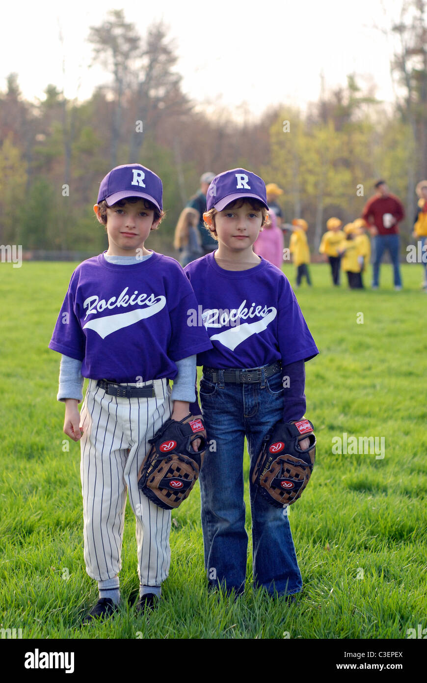 Twin, six year-old boys in their tee-ball uniforms Stock Photo - Alamy