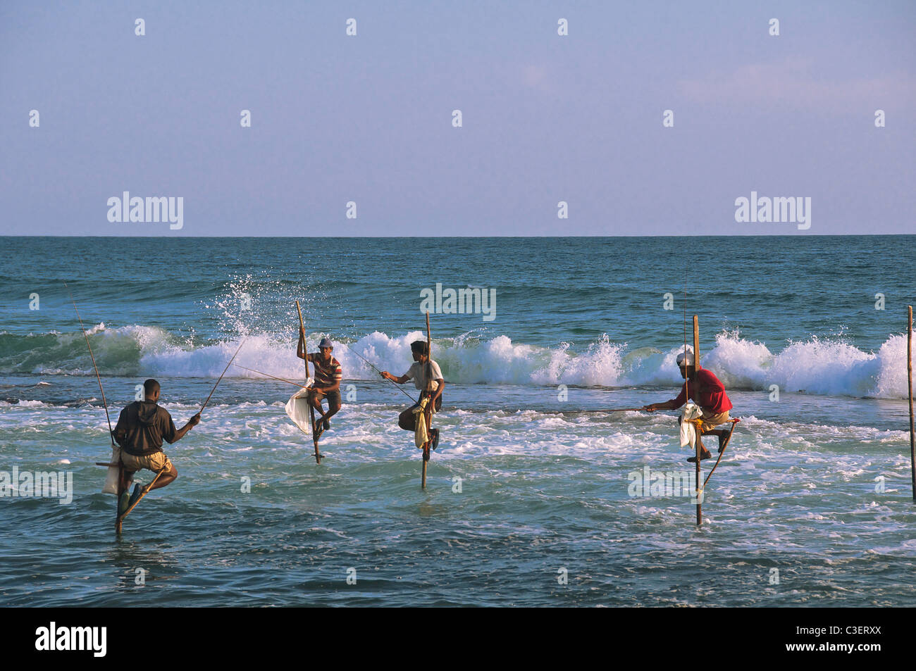 Four pole fishermen Koggala Beach South Coast Sri Lanka Stock Photo