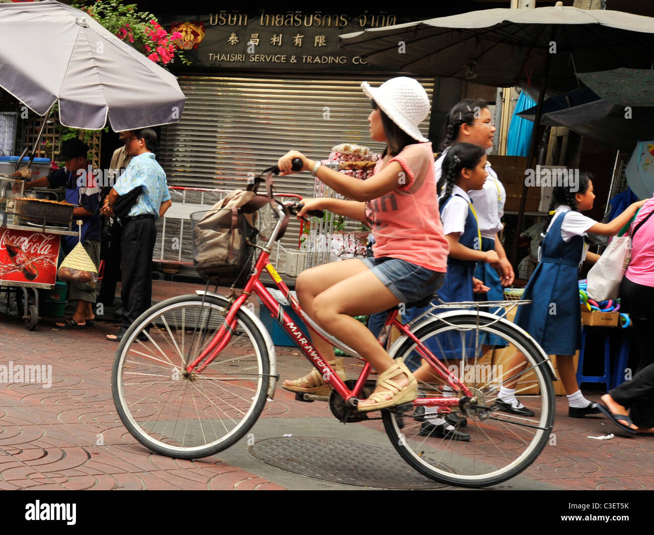 girl riding her bicycle, Thai Chinese people , Everyday living, street