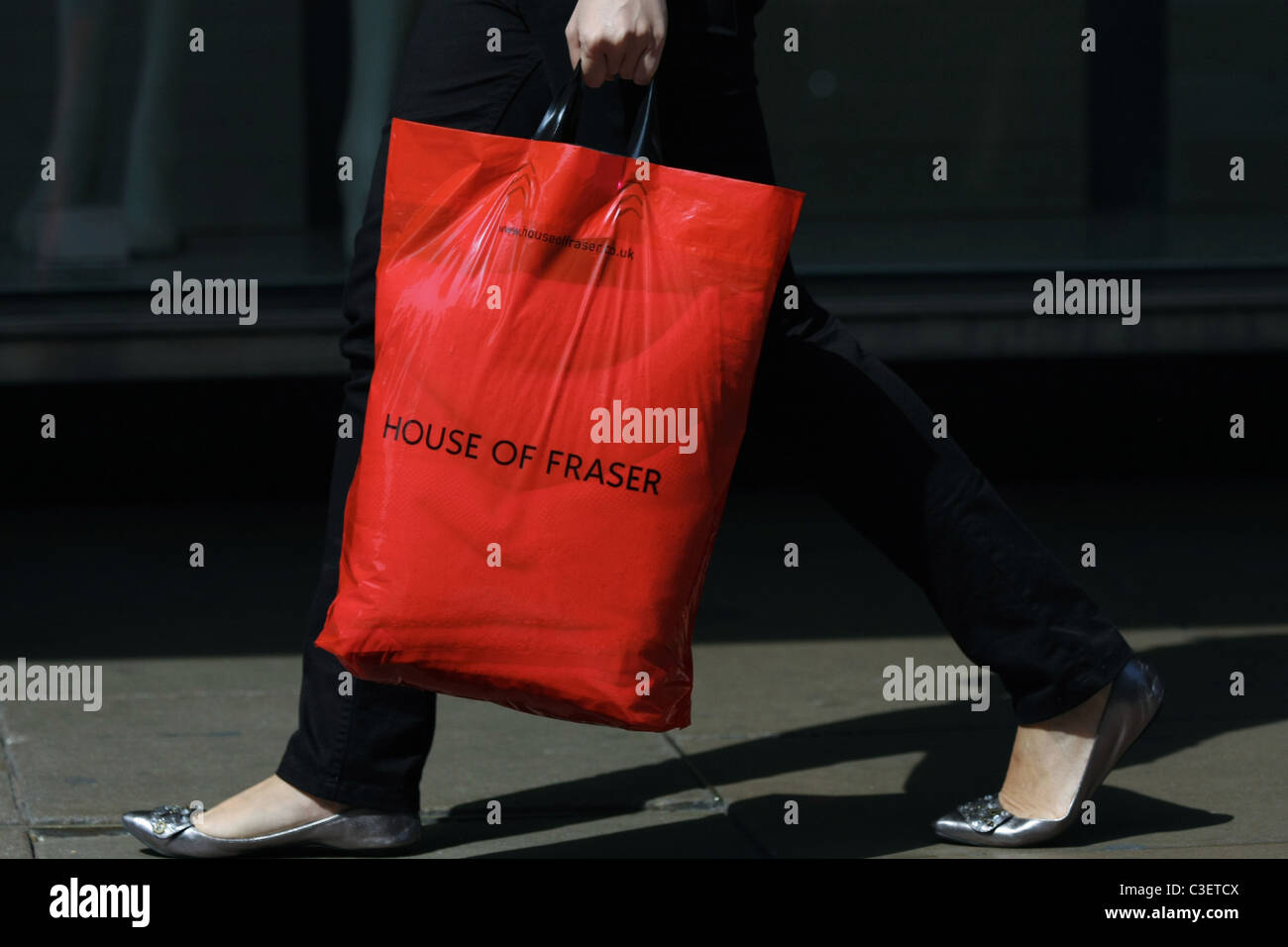 Shopping bags being carried by a female in Oxford Street, London, England Stock Photo
