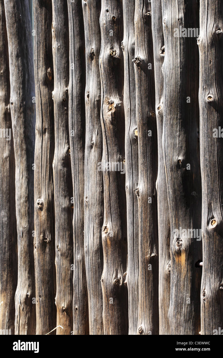 gray weathered vertical pine log fence angled image Stock Photo